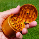 Opened orange Cali Crusher OG Slick Non-Stick Ceramic 4PC Grinder NZ