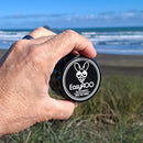 Holding an EasyRoo 3pc 63mm Grinderoo Grinder at West Coast Beach NZ