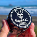 Holding an EasyRoo 3pc 63mm Non-Stick Grinderoo Grinder at the beach NZ
