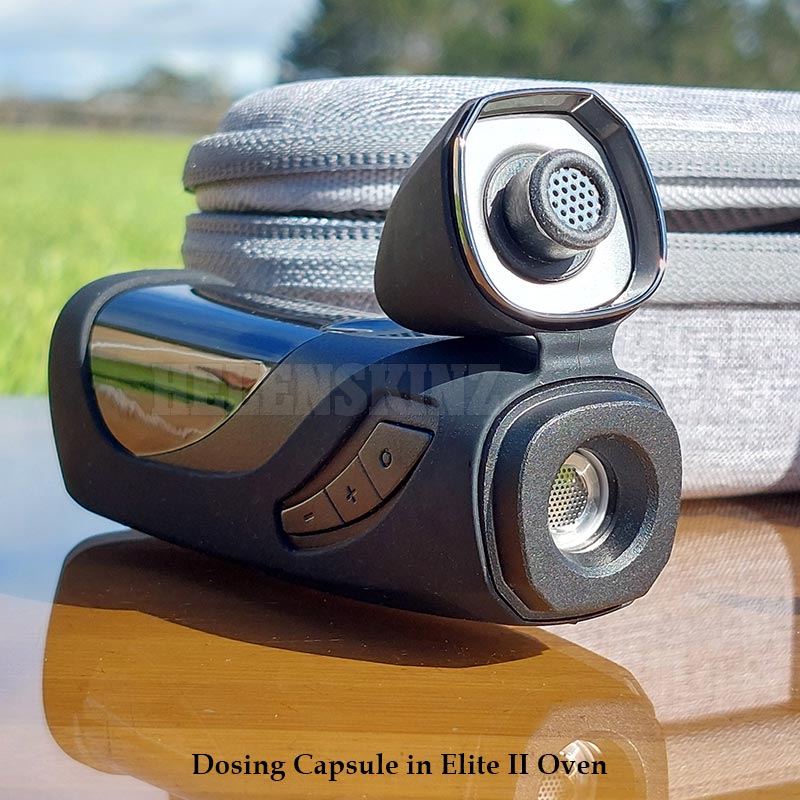 Dosing capsule in Elite II oven with grassy background