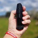 Holding a G Pen Elite II medical vaporizer on side with Silicone Skin NZ
