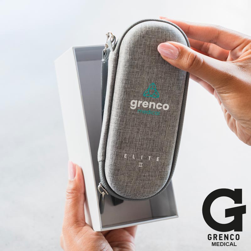 Gray carrying case with Grenco Medical logo held by a hand NZ