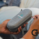 Gray carrying case with Grenco Medical logo held by a person, brand logo visible.