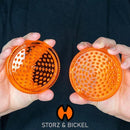 Holding a Herb Mill XL Grinder NZ