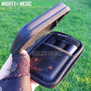 Black soft case with mesh interior held by a hand on grass background, featuring 'Mighty+ Medic' branding.