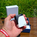 Holding an Oleo Panacea Dry Herb Vaporizer outdoors NZ