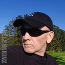 Wearing a Black PAX Baseball Cap NZ