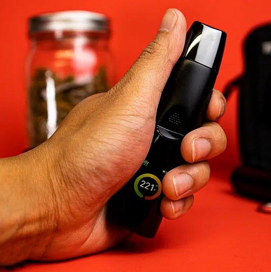 Holding a G Pen Elite II Certified Medical Vape NZ