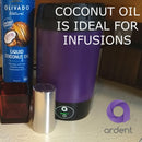 Purple container with a metal cup on a wooden surface, next to a bottle of coconut oil, with text about coconut oil being ideal for infusions.