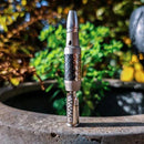 The DynaVap VonG X vaporizer pen in the garden