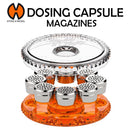 Dosing capsule magazine with clear and orange design on a white background, featuring Storz & Bickel logo.