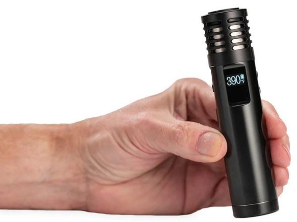 Holding an Arizer Air MAX Dry Herb vaporizer by Arizer Canada