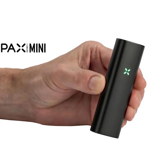 Holding the Pax Mini Vaporizer NZ