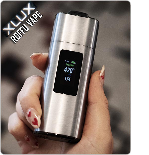 Holding a grey XVape XLUX Roffu NZ